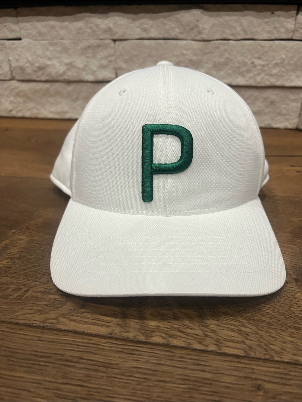 PUMA Golf P hat in white with green P